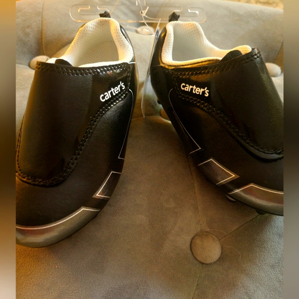 Outdoor Kids Cleats in Black with tags